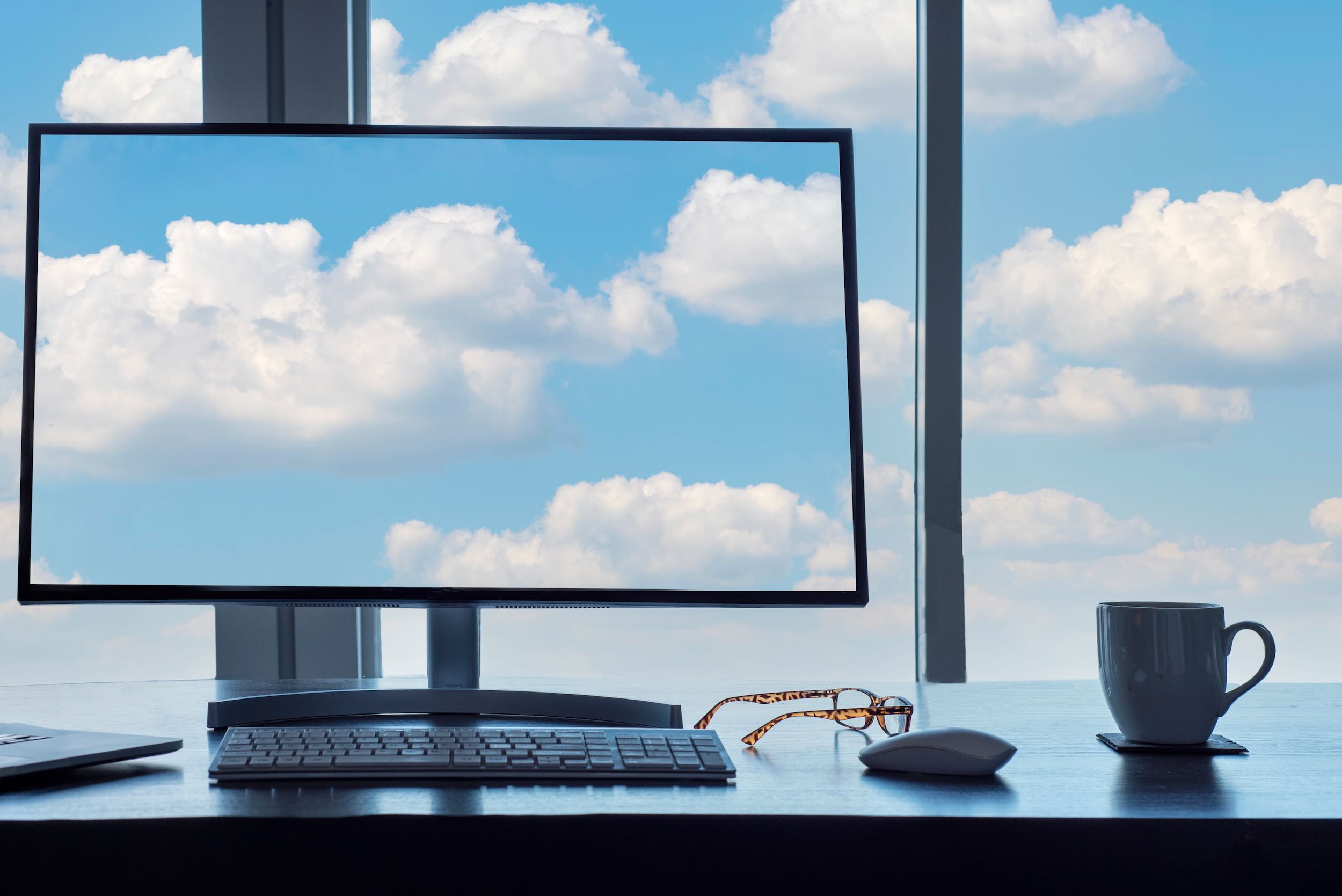 conceptual-cloud-computing-desk-with-computer-key